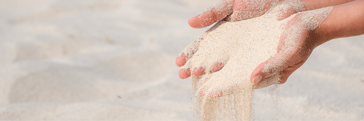 sand falling through hands
